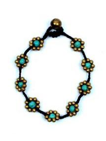 ZAS robapinzas.com | pulsera flor de bolas de lat&oacute;n y tuirquesas, cierre de bot&oacute;n